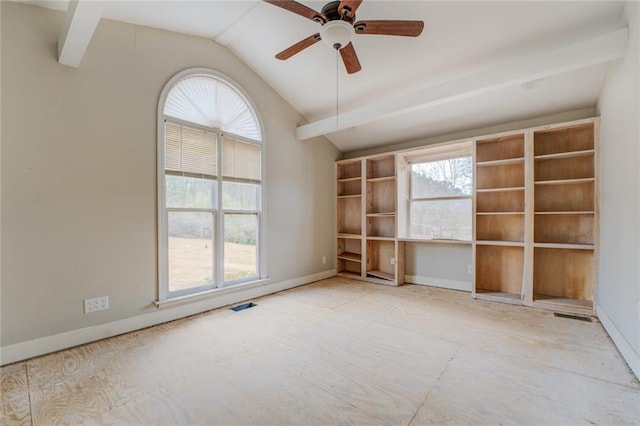 spare room with a wealth of natural light, ceiling fan, and vaulted ceiling