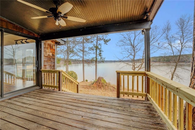 wooden deck featuring ceiling fan and a water view