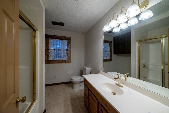 bathroom featuring vanity, a textured ceiling, and toilet