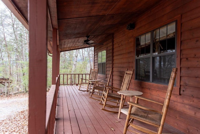 wooden deck with ceiling fan and a porch