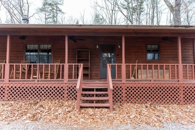 back of property with covered porch and ceiling fan