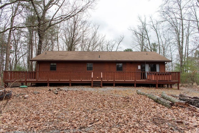 back of property featuring a wooden deck