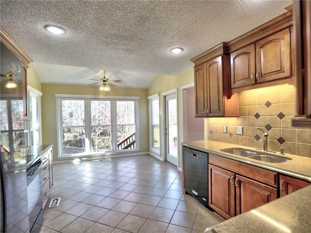 kitchen with dishwashing machine, lofted ceiling, a sink, light countertops, and dishwasher