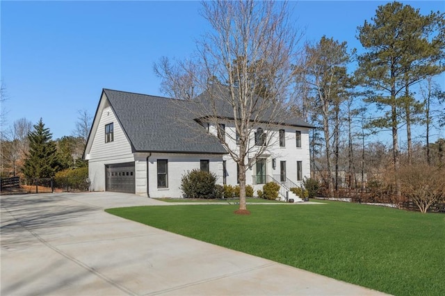 view of front of house with a garage and a front yard