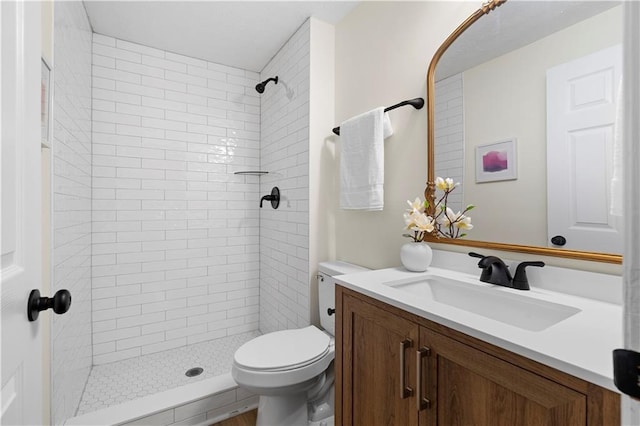 1275 Muirforest Way, Stone Mountain, GA 30088 - bathroom featuring vanity, toilet, and tiled shower