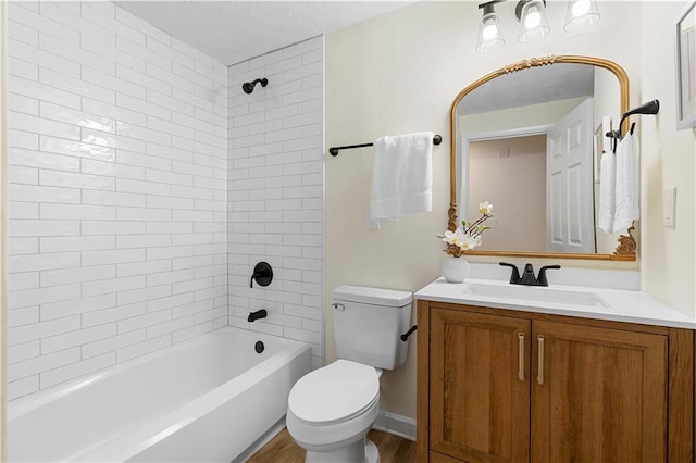 1275 Muirforest Way, Stone Mountain, GA 30088 - bathroom with toilet, vanity, bathing tub / shower combination, wood finished floors, and a textured ceiling