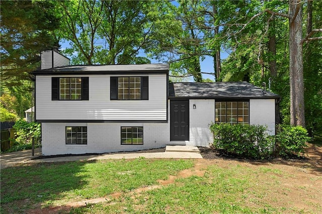 1275 Muirforest Way, Stone Mountain, GA 30088 - tri-level home with brick siding and a chimney