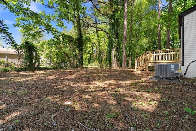 1275 Muirforest Way, Stone Mountain, GA 30088 - view of yard featuring central air condition unit, a wooden deck, and stairs