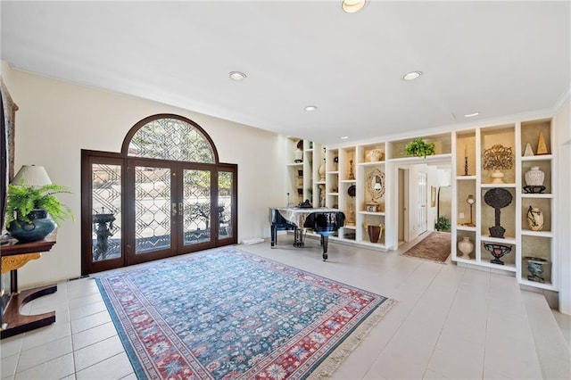 entryway featuring recessed lighting, tile patterned flooring, and french doors