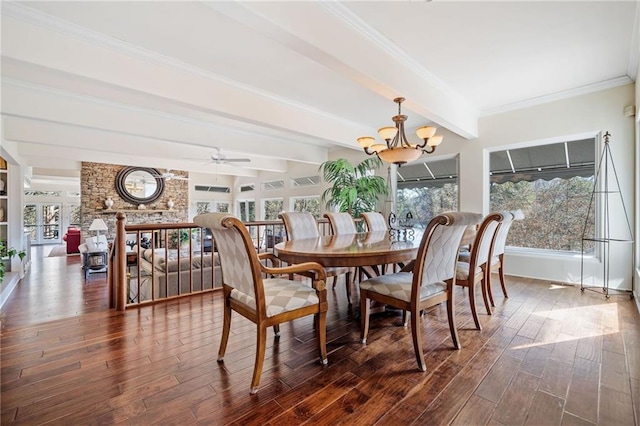 dining room with dark wood-style floors, ceiling fan with notable chandelier, beam ceiling, and crown molding