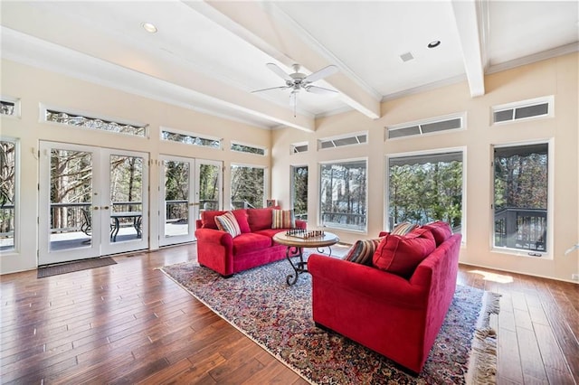 sunroom with a ceiling fan, a wealth of natural light, french doors, and beam ceiling