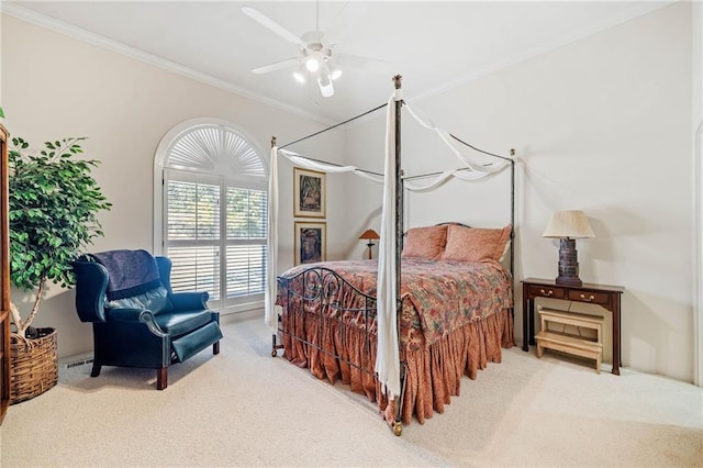 bedroom with carpet, ornamental molding, and ceiling fan