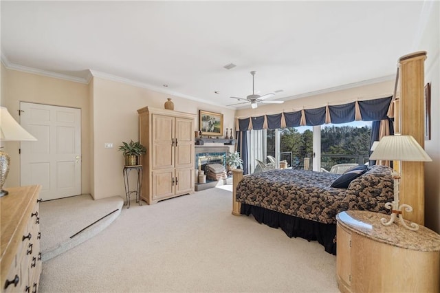 bedroom with visible vents, a fireplace with raised hearth, light colored carpet, ceiling fan, and ornamental molding