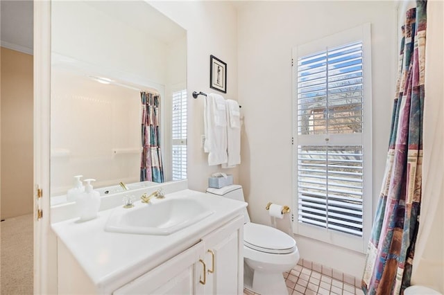 full bathroom featuring toilet, tile patterned flooring, and vanity