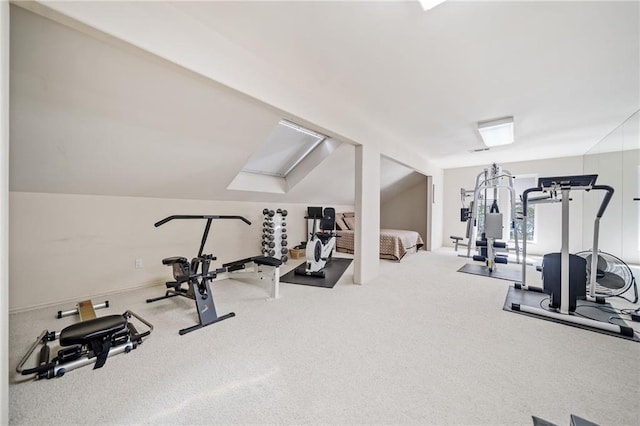 workout room featuring lofted ceiling and carpet floors