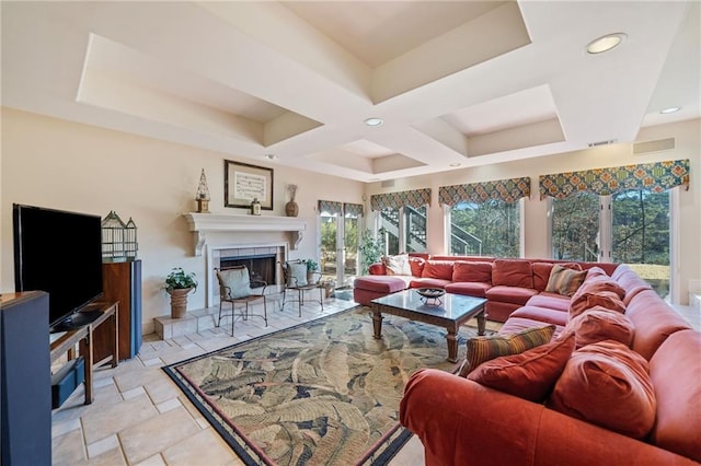 living room featuring recessed lighting, visible vents, stone tile floors, and a tiled fireplace