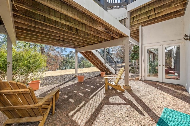 view of patio / terrace with french doors and stairs