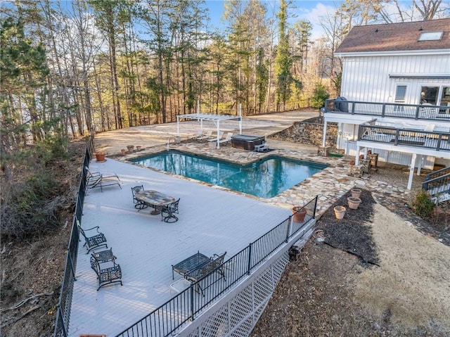 pool featuring a patio and a hot tub