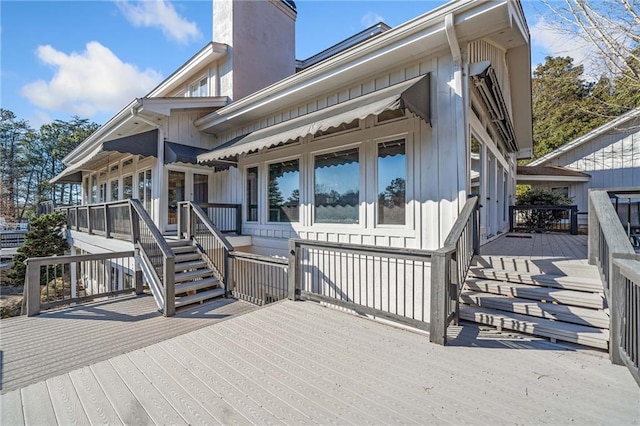 exterior space featuring a deck and a chimney