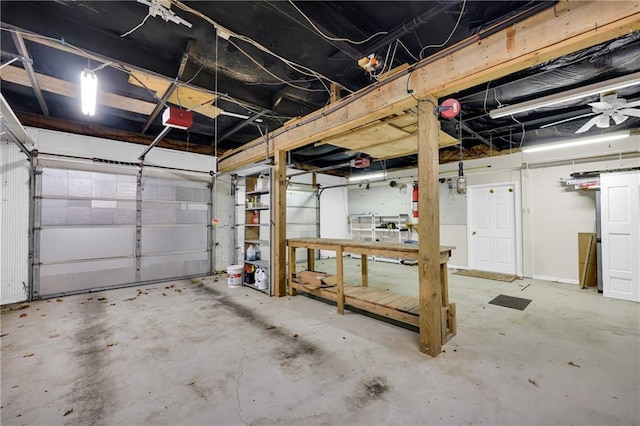 garage featuring ceiling fan and a garage door opener