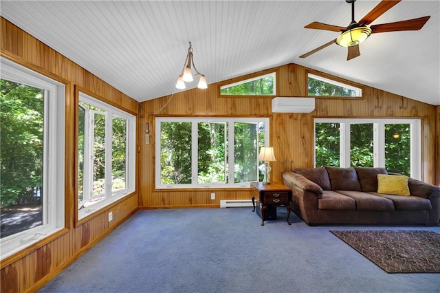 sunroom with a wealth of natural light, baseboard heating, and a wall mounted air conditioner