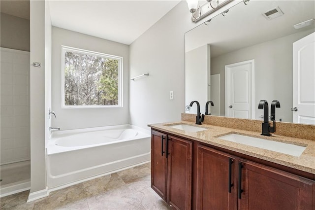 full bathroom with a bath, double vanity, visible vents, and a sink