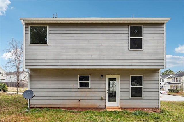 rear view of house with a lawn