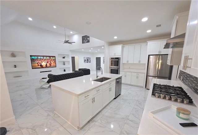 kitchen with white cabinetry, sink, wall chimney range hood, and stainless steel appliances