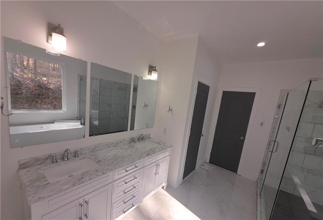 bathroom with independent shower and bath and vanity