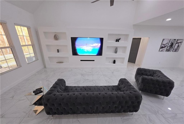 living room featuring ceiling fan, high vaulted ceiling, and built in features