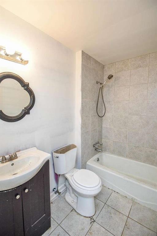 full bathroom featuring toilet, bathtub / shower combination, vanity, and tile patterned flooring