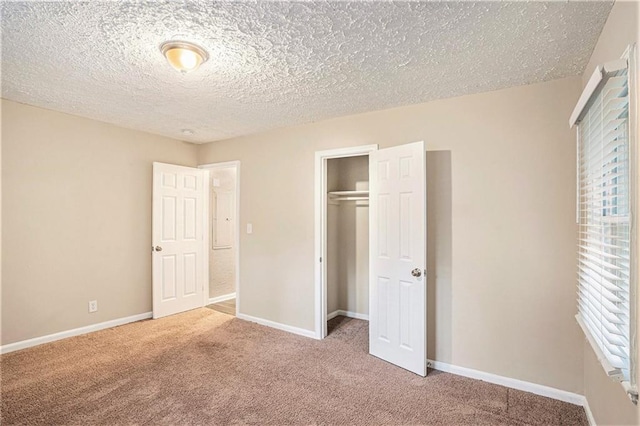 2791 Mcafee Rd, Decatur, GA 30032 - unfurnished bedroom featuring carpet flooring, a closet, and a textured ceiling