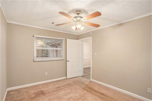 2791 Mcafee Rd, Decatur, GA 30032 - spare room featuring a textured ceiling, light colored carpet, ceiling fan, and ornamental molding