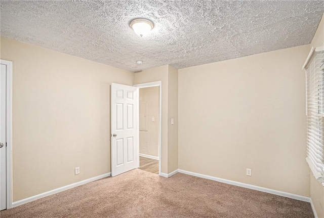 2791 Mcafee Rd, Decatur, GA 30032 - unfurnished bedroom with carpet flooring and a textured ceiling