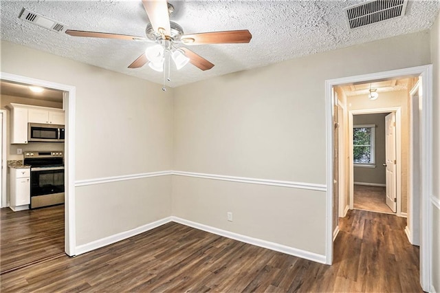 2791 Mcafee Rd, Decatur, GA 30032 - unfurnished room featuring ceiling fan, dark wood-type flooring, and a textured ceiling
