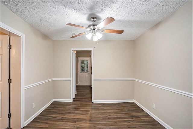 2791 Mcafee Rd, Decatur, GA 30032 - unfurnished room with a textured ceiling, dark hardwood / wood-style floors, and ceiling fan