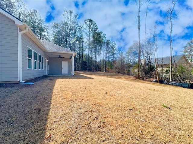 view of yard with ceiling fan