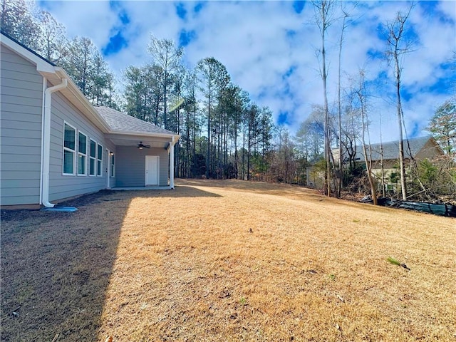 view of yard featuring a ceiling fan