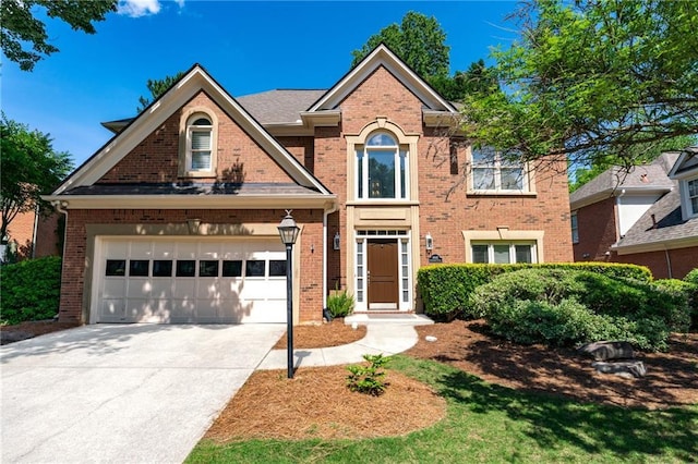 4648 Glenshire Pl, Atlanta, GA 30338 - view of front of home with brick siding, driveway, and a garage