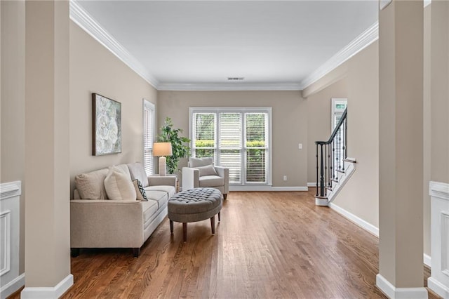 4648 Glenshire Pl, Atlanta, GA 30338 - sitting room with wood finished floors, crown molding, stairs, and baseboards