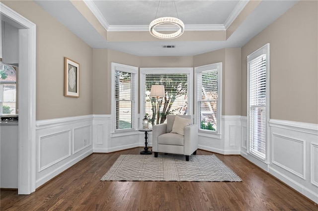 4648 Glenshire Pl, Atlanta, GA 30338 - living area with a raised ceiling, dark wood finished floors, wainscoting, a chandelier, and crown molding