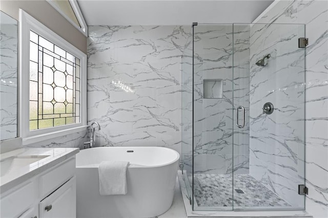 4648 Glenshire Pl, Atlanta, GA 30338 - bathroom with tile walls, a freestanding tub, a shower stall, vanity, and marble finish flooring