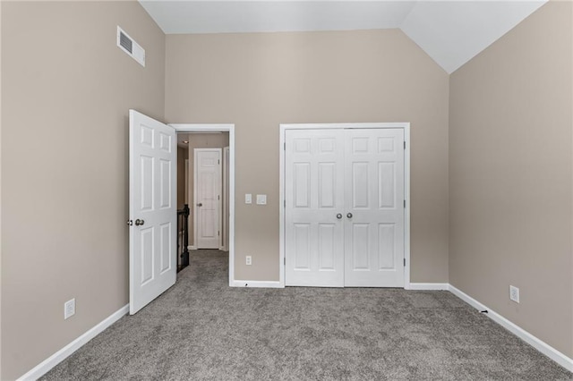 4648 Glenshire Pl, Atlanta, GA 30338 - unfurnished bedroom with carpet, baseboards, a closet, and high vaulted ceiling