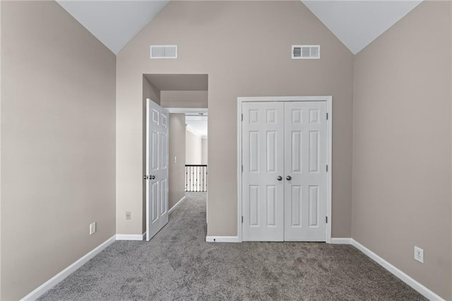 4648 Glenshire Pl, Atlanta, GA 30338 - unfurnished bedroom with carpet, baseboards, a closet, and high vaulted ceiling