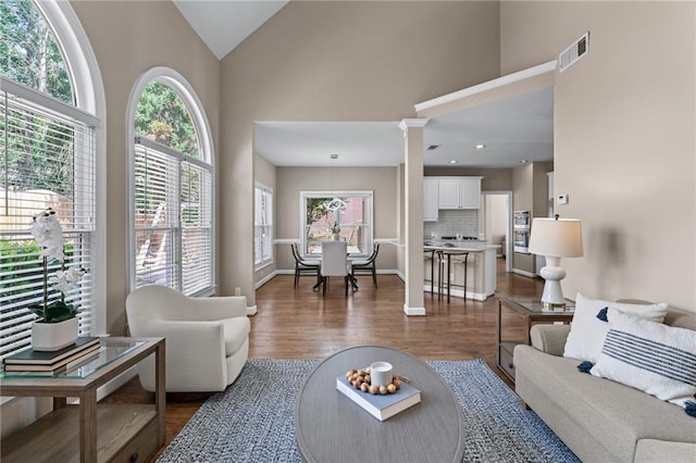 4648 Glenshire Pl, Atlanta, GA 30338 - living area with high vaulted ceiling, dark wood-style flooring, recessed lighting, and baseboards