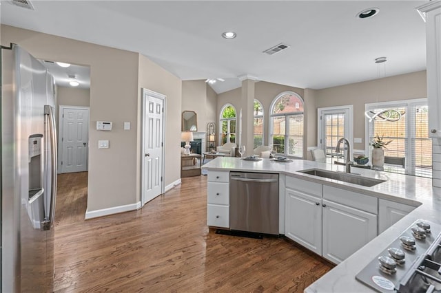 4648 Glenshire Pl, Atlanta, GA 30338 - kitchen featuring a sink, stainless steel appliances, dark wood-style floors, healthy amount of natural light, and lofted ceiling
