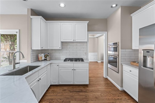 4648 Glenshire Pl, Atlanta, GA 30338 - kitchen with appliances with stainless steel finishes, a sink, recessed lighting, white cabinets, and dark wood-style flooring