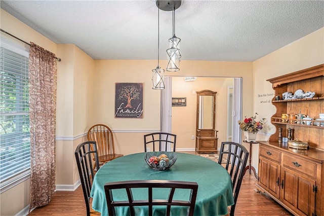 2130 Hampton Trl SE, Conyers, GA 30013 - dining room featuring dark wood-style flooring and a textured ceiling