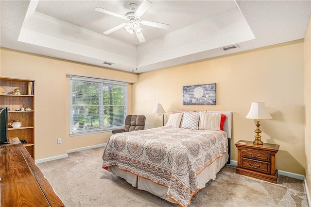 2130 Hampton Trl SE, Conyers, GA 30013 - bedroom with a tray ceiling, carpet floors, and a ceiling fan