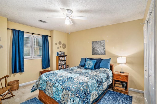 2130 Hampton Trl SE, Conyers, GA 30013 - carpeted bedroom featuring a textured ceiling and ceiling fan
